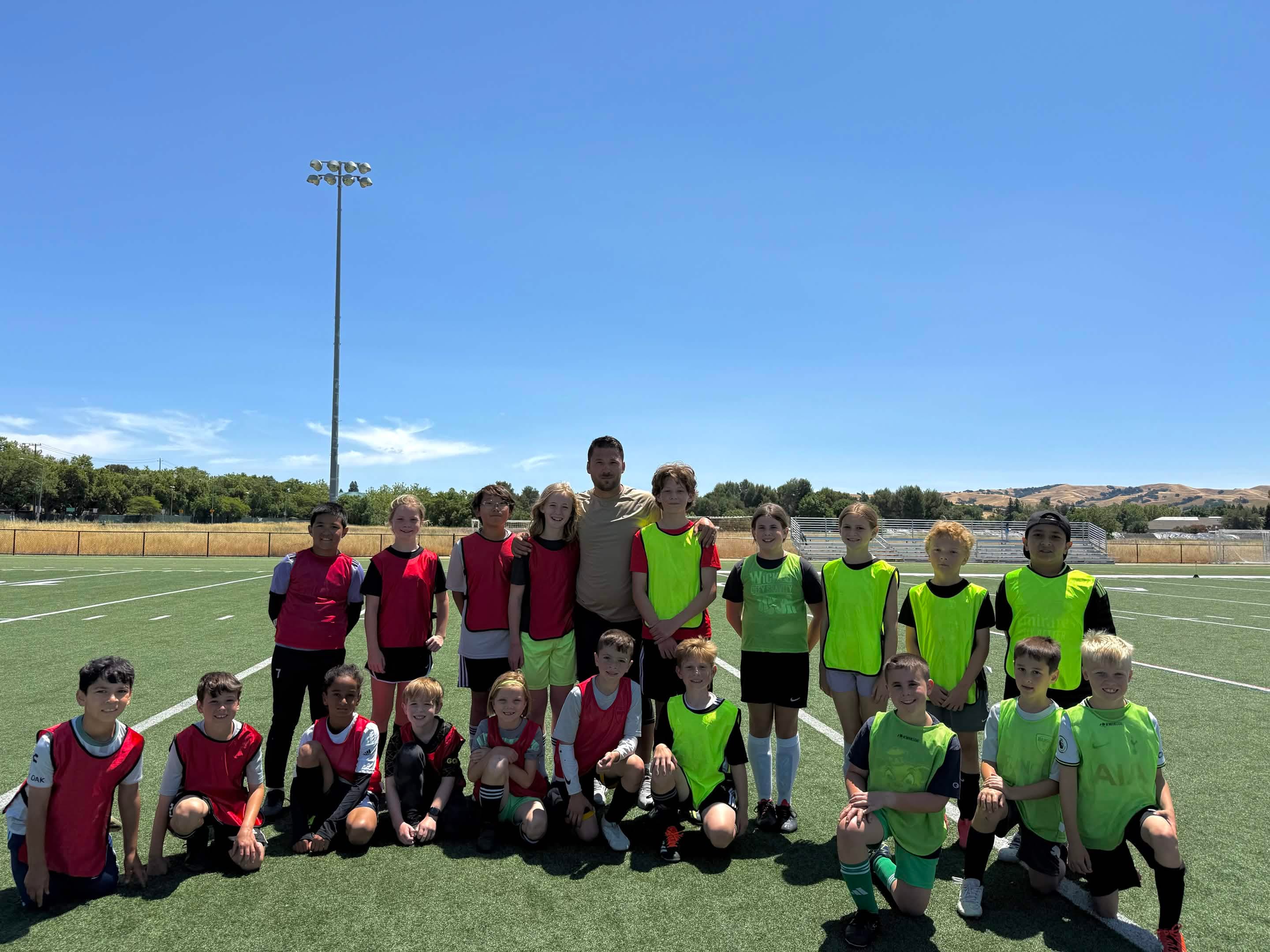 Young soccer players training with coach at Allstar Kids Pleasanton